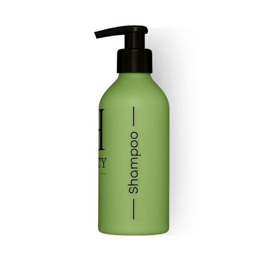 Green shampoo bottle with pump on a white background